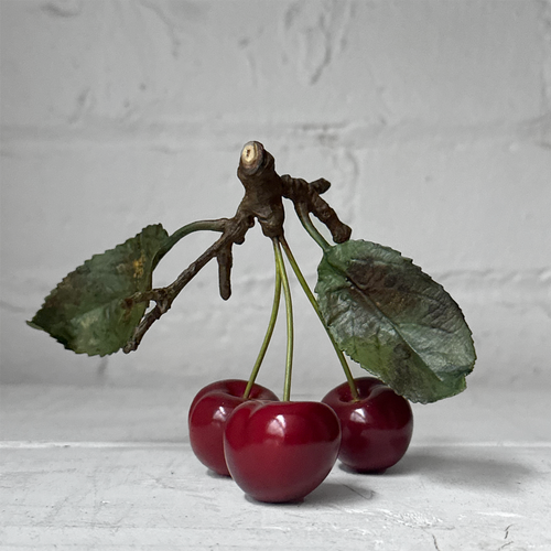 Three Porcelain Cherries with Two Leaves